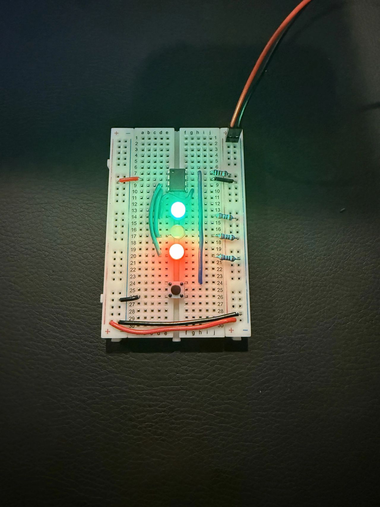 Three-LED breadboard with a button, in normal state