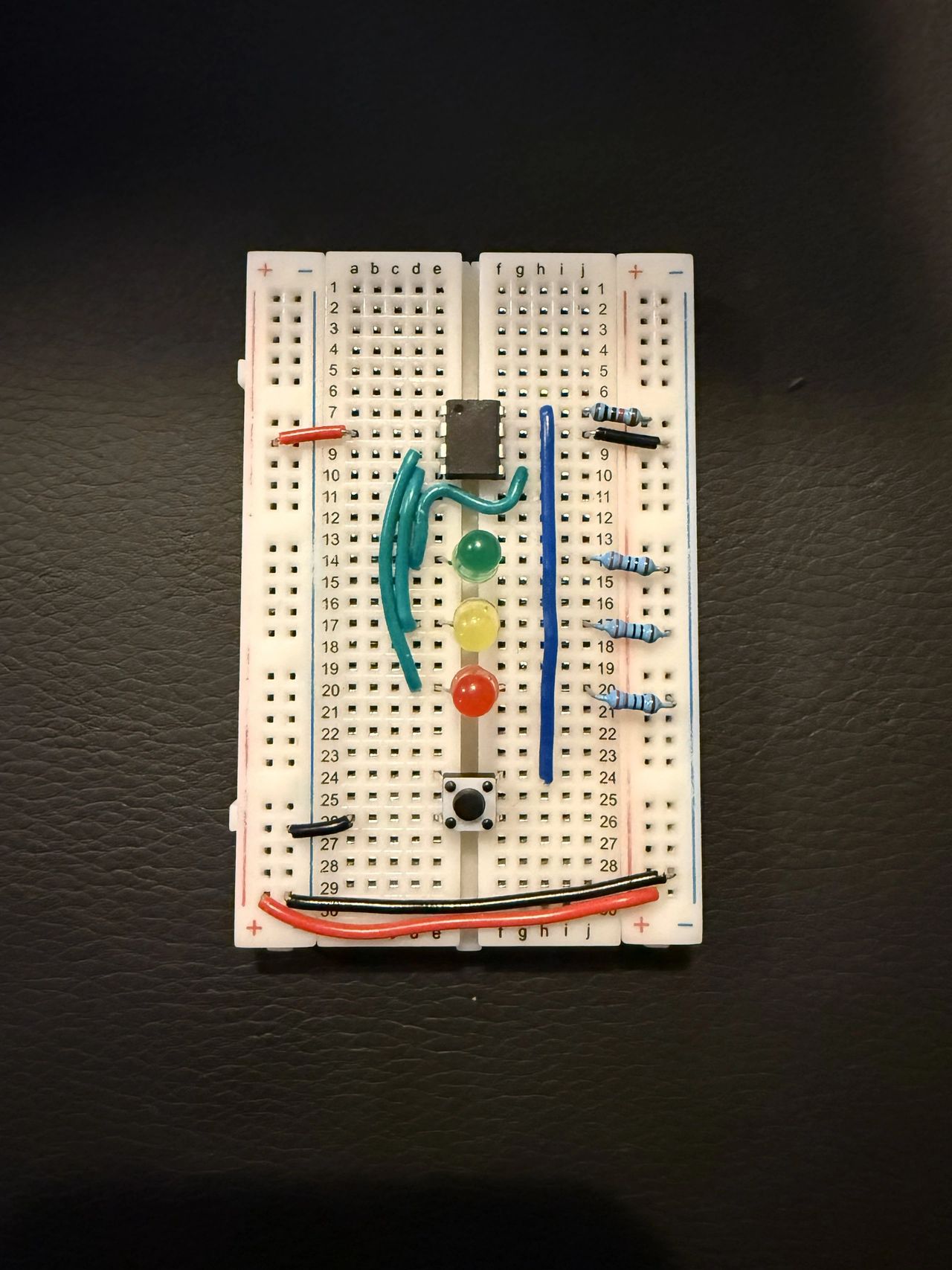 Three-LED and button breadboard setup